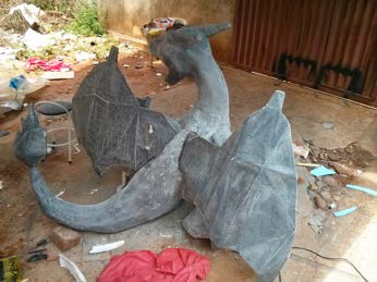 The full body in grey filler outdoors during sanding and surface preparation.
