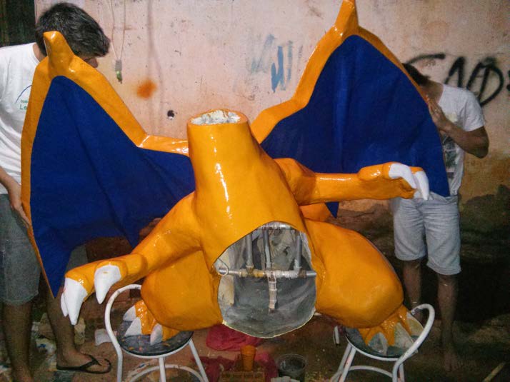 The part-painted build outdoors with the servo-driven wings fitted to the reinforced body.