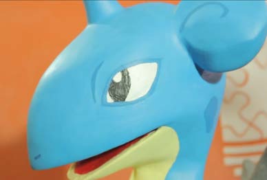 Close-up of the painted head showing airbrushed shading around the eye and mouth.
