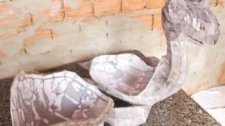 The paper shell of the body and neck taped together before resin coating.