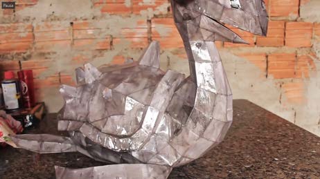 The raw Pepakura paper shell of the body assembled on the workshop floor.