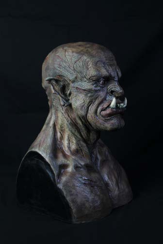 Rear view of the orc bust showing scalp texture and neck musculature.