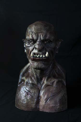 Rear three-quarter view of the finished orc bust on a black background.