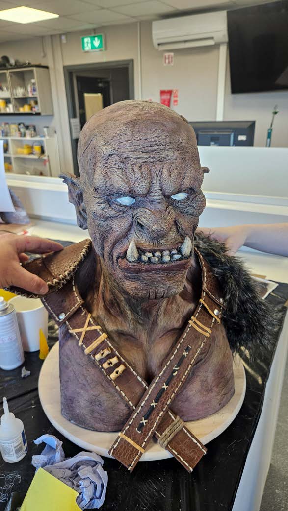 The bust part-way through paint finishing, with base tones blocked in.