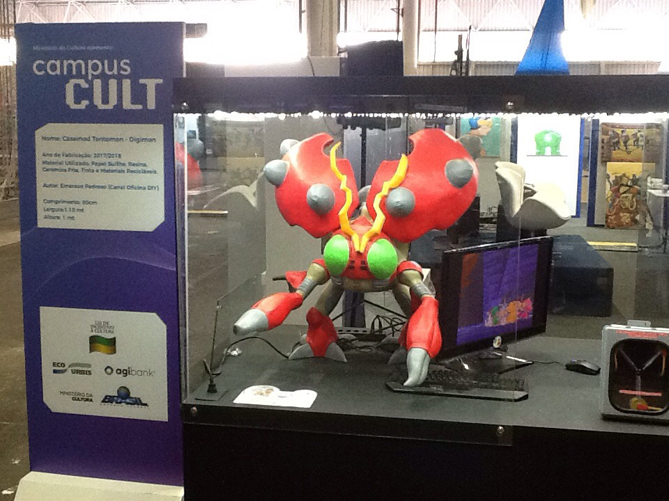 The finished character computer running on a display stand at Campus Party São Paulo.