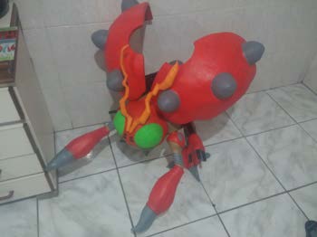 Angled view of the finished character build showing painted shell panels and claw detail.