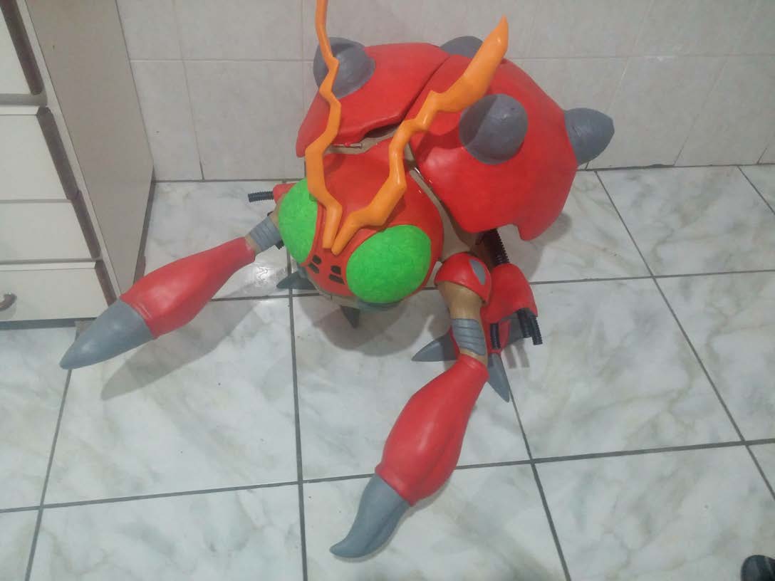 Finished one-metre red and grey insect character build standing on a tiled floor, painted and assembled.
