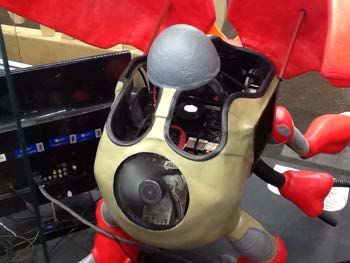 The open shell showing installed computer hardware and internal cooling inside the character body.