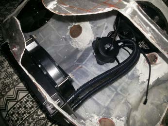 Water-cooling loop and tubing routed inside the reinforced shell.